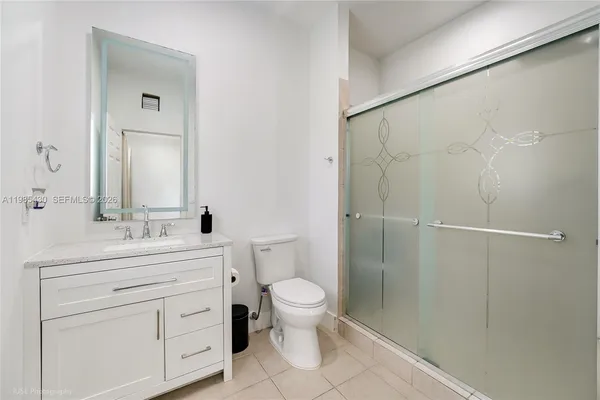 a kitchen with stainless steel appliances a refrigerator and a stove
