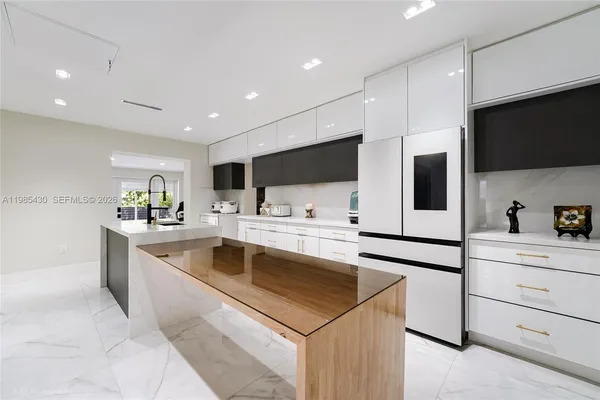 a kitchen with a sink stove and microwave
