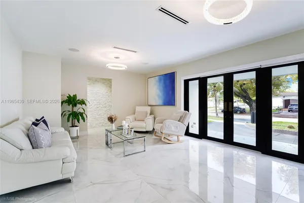 a living room with furniture and a large window