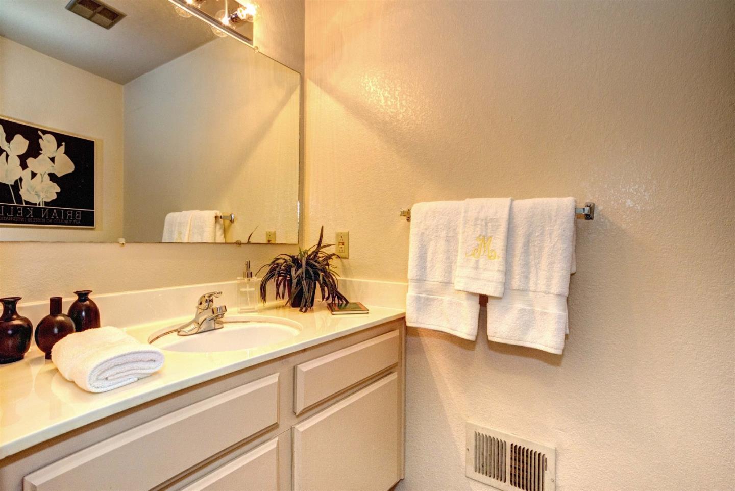 2708 Glen Ferguson Circle San Jose, CA 95148 - Photo 12 of 23 a bathroom with a sink and a mirror