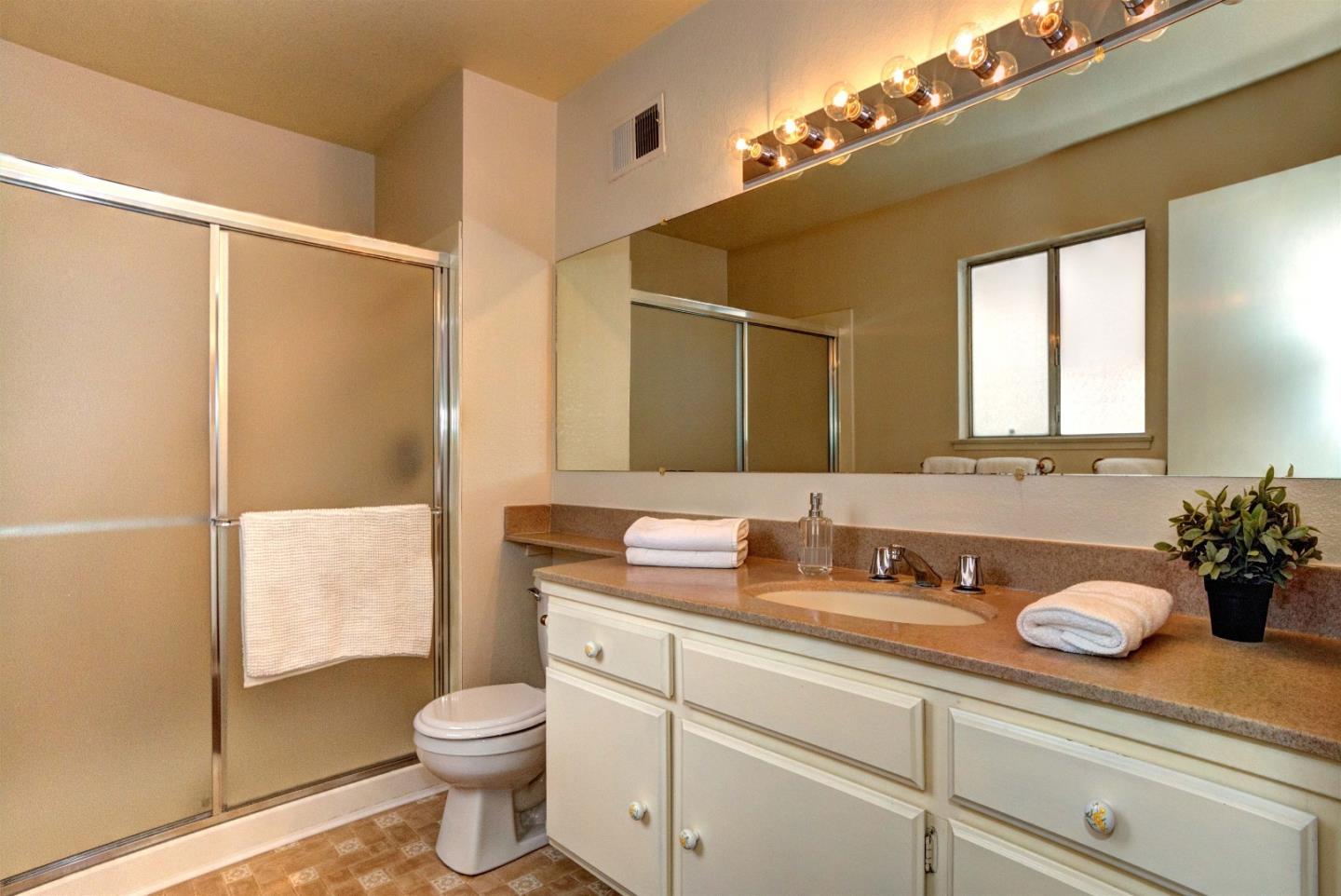 2708 Glen Ferguson Circle San Jose, CA 95148 - Photo 16 of 23 a bathroom with a sink a toilet and shower