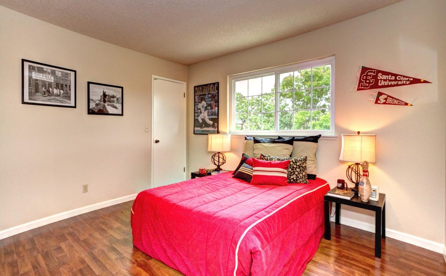 2708 Glen Ferguson Circle San Jose, CA 95148 - Photo 17 of 23 a bedroom with a bed and wooden floor