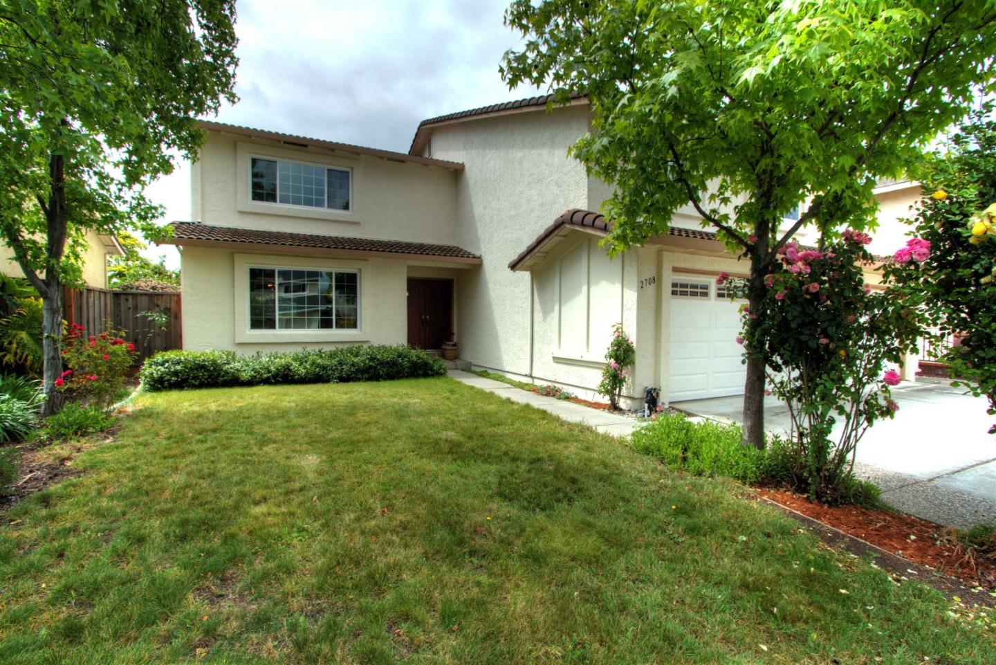 2708 Glen Ferguson Circle San Jose, CA 95148 - Photo 2 of 23 a front view of a house with a yard