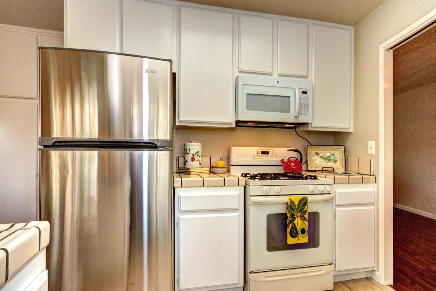 2708 Glen Ferguson Circle San Jose, CA 95148 - Photo 6 of 23 a kitchen with stainless steel appliances a refrigerator and a stove top oven