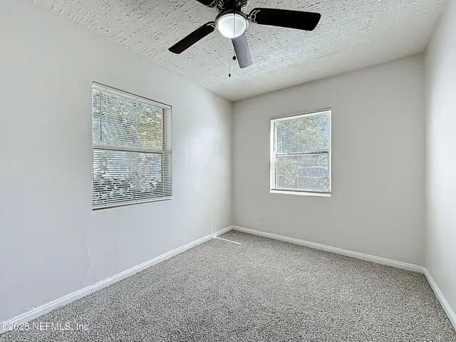 a view of an empty room with window