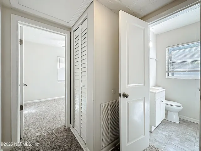 a bathroom with a sink toilet and a mirror
