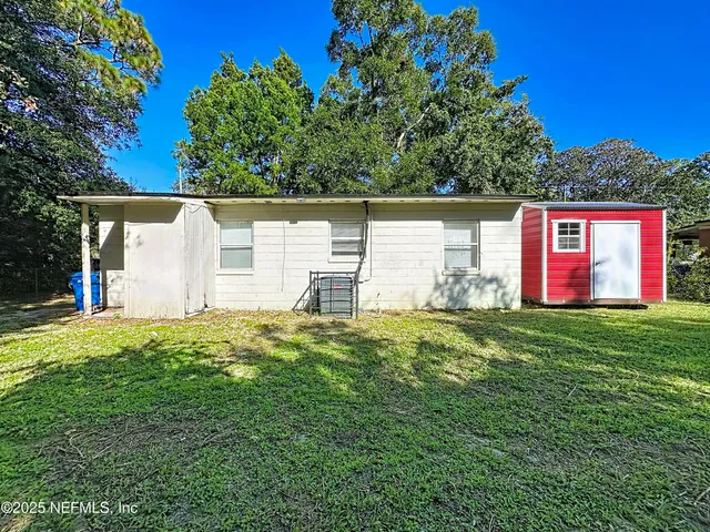 a backyard of a house with lots of green space