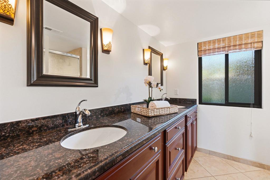 13319 Pacer Lane Poway, CA 92064 - Photo 43 of 75 a bathroom with 2 sink and a mirror