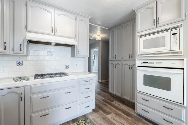 a view of an empty room with windows