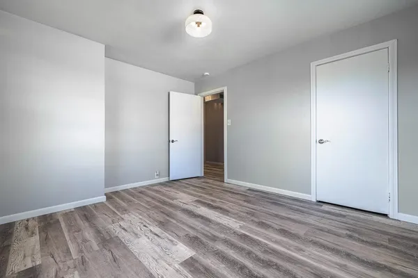 a view of an empty room with a fireplace