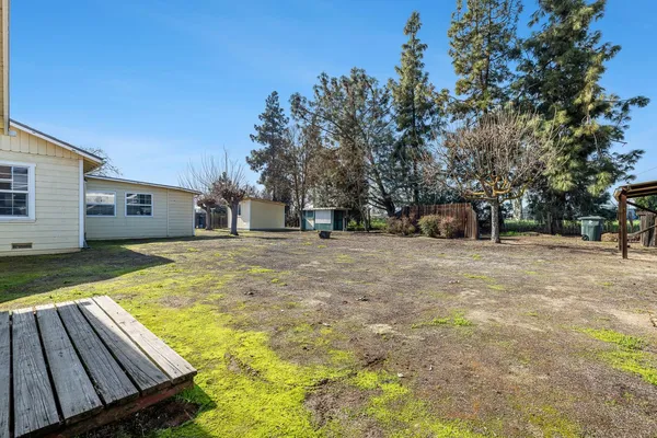a view of a backyard of the house