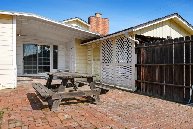 a bench sitting in front of a house