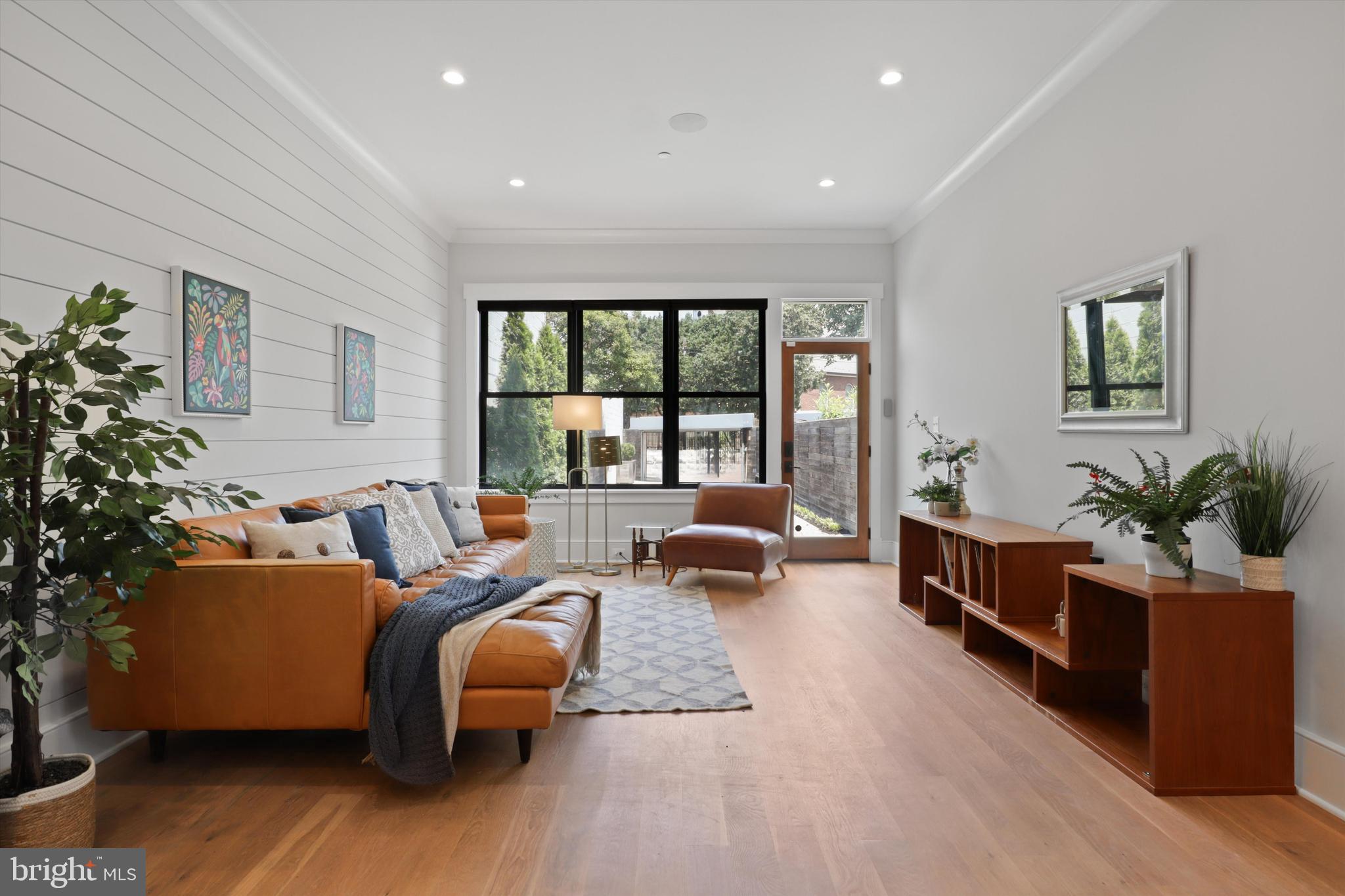 1432 G Street Southeast Washington, DC 20003 - Photo 18 of 56 a living room with furniture and a large window