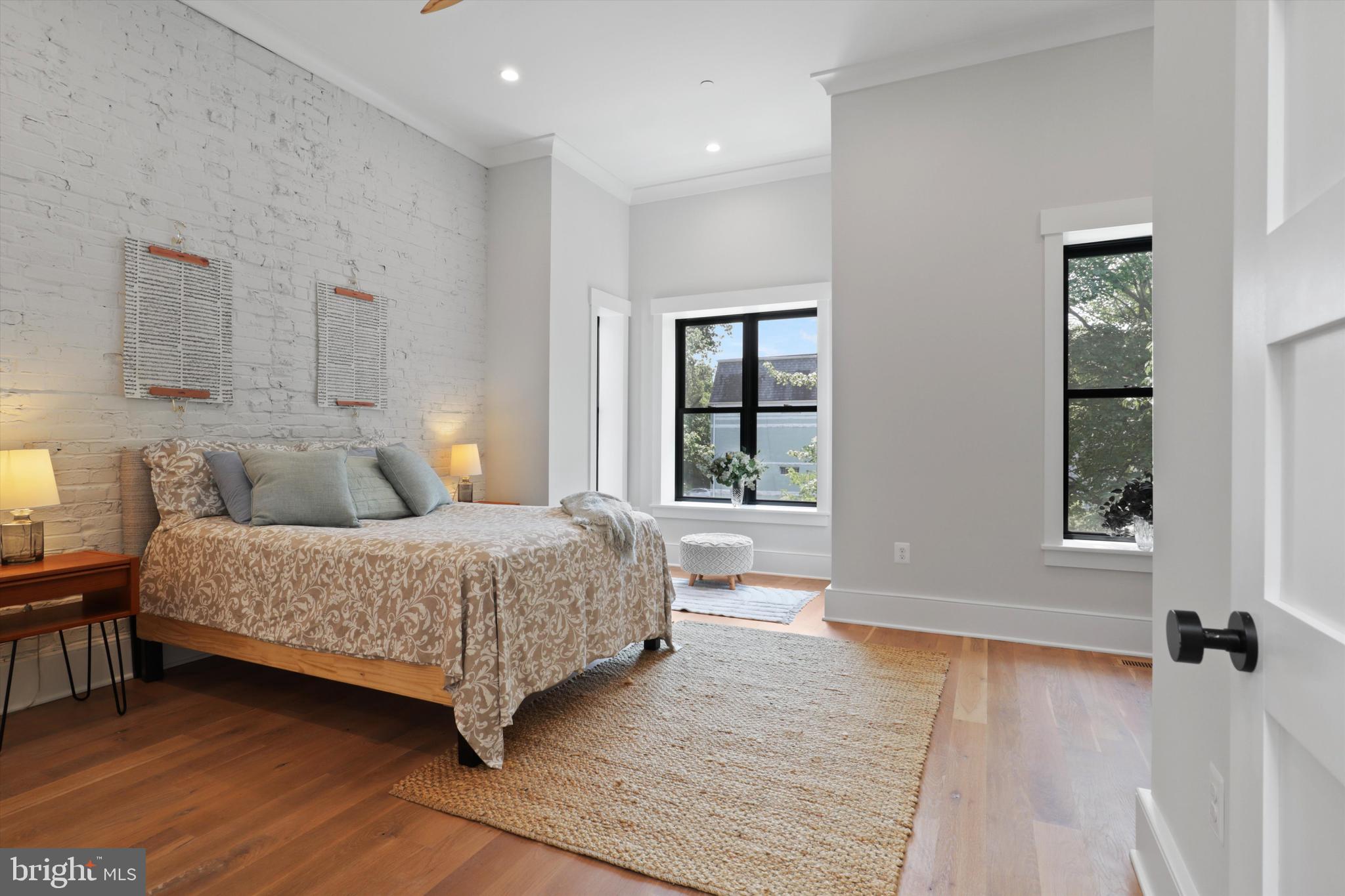 1432 G Street Southeast Washington, DC 20003 - Photo 22 of 56 a bedroom with a large bed and a window