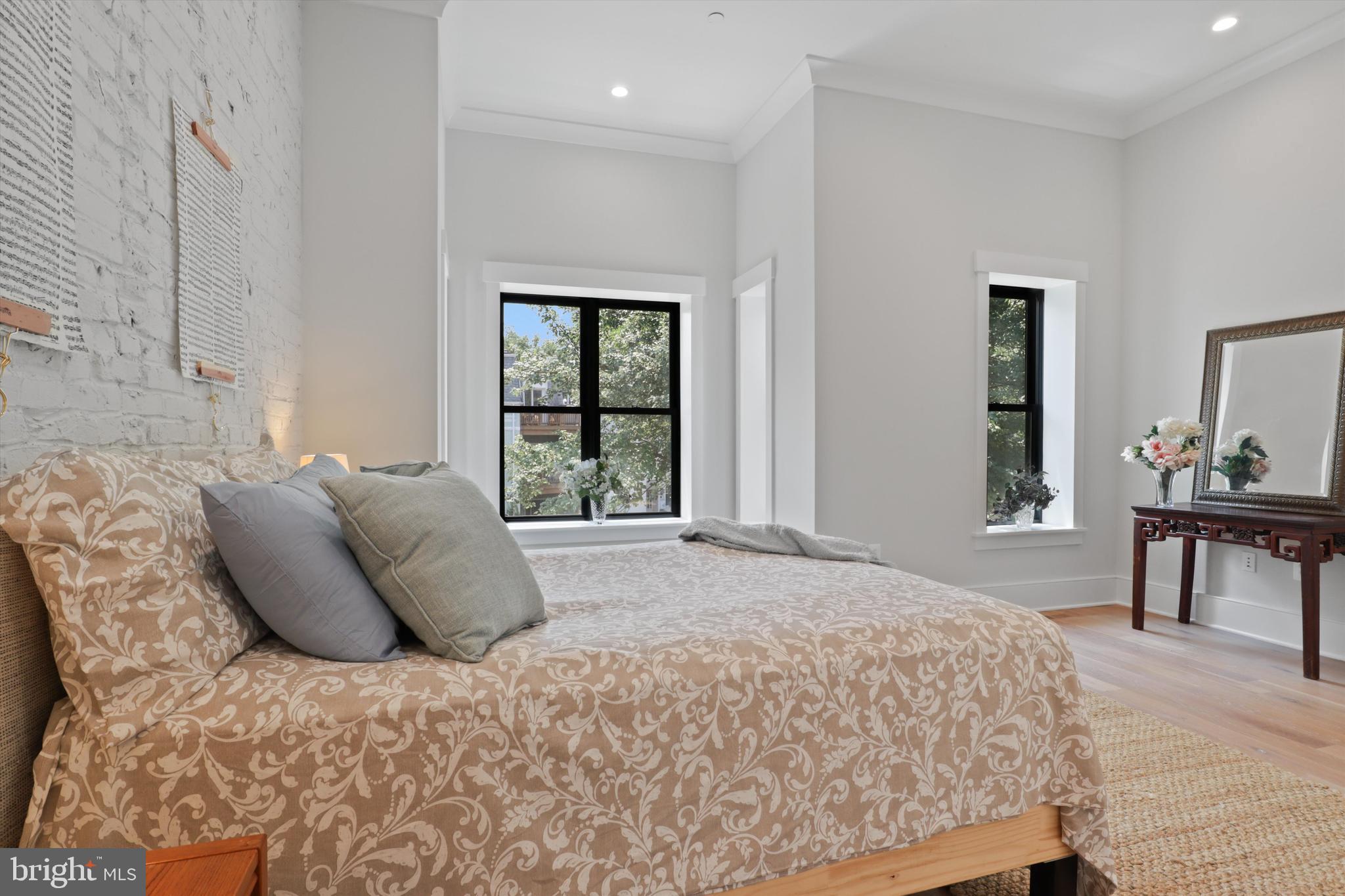 1432 G Street Southeast Washington, DC 20003 - Photo 23 of 56 a large bed sitting in a bedroom next to a window