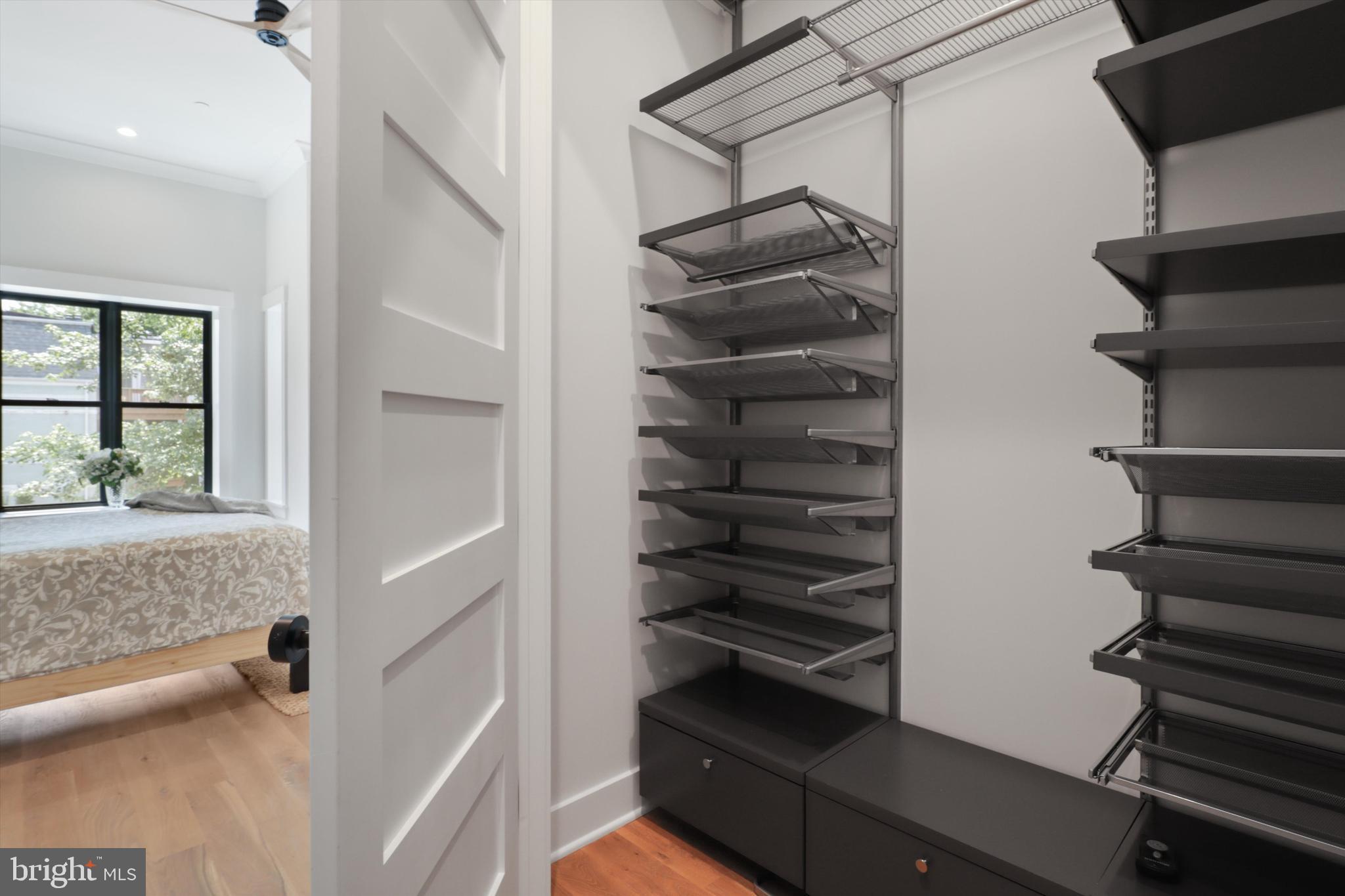 1432 G Street Southeast Washington, DC 20003 - Photo 26 of 56 a view of walk in closet with empty racks