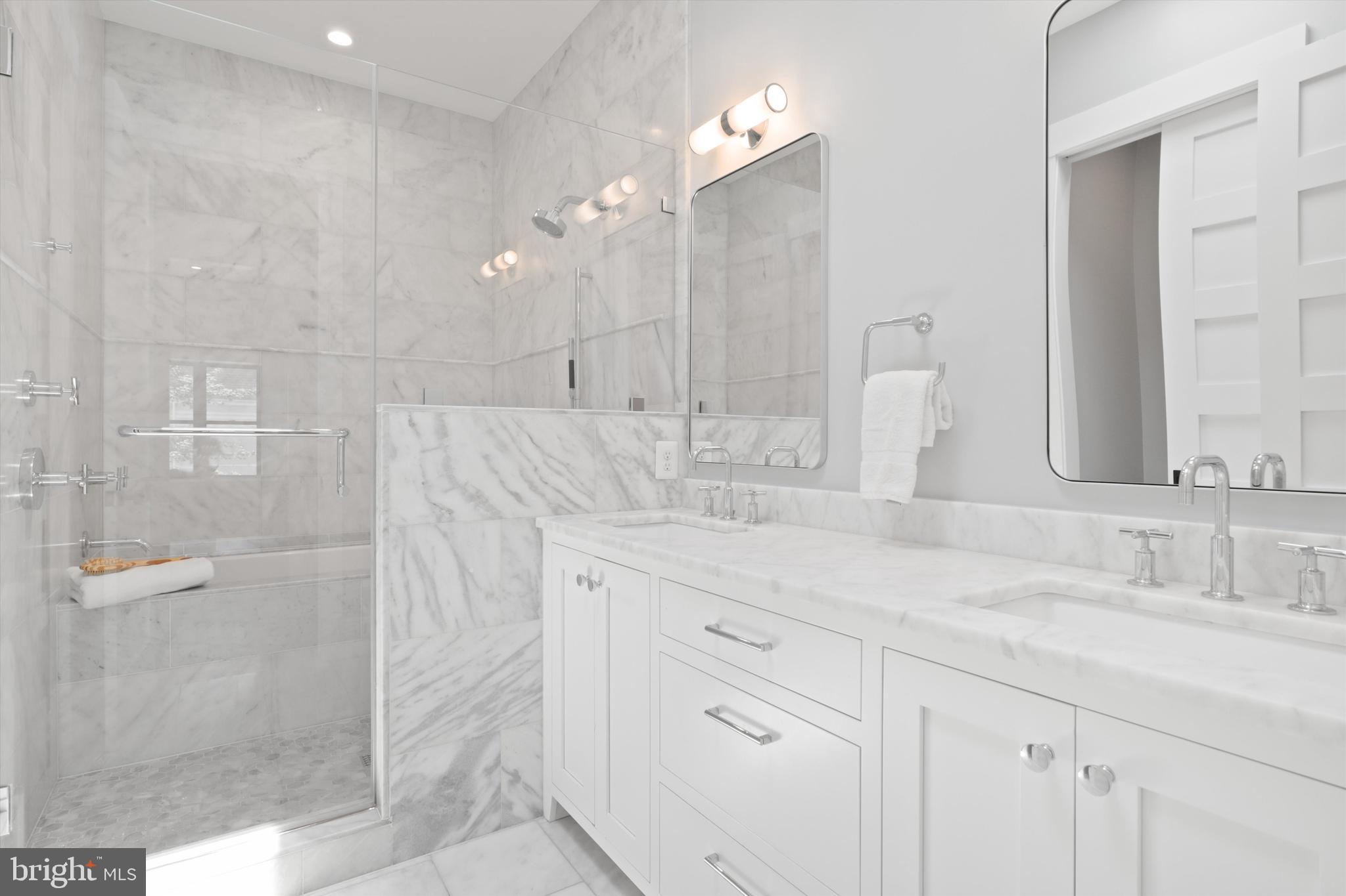 1432 G Street Southeast Washington, DC 20003 - Photo 27 of 56 a bathroom with a double vanity sink mirror and shower