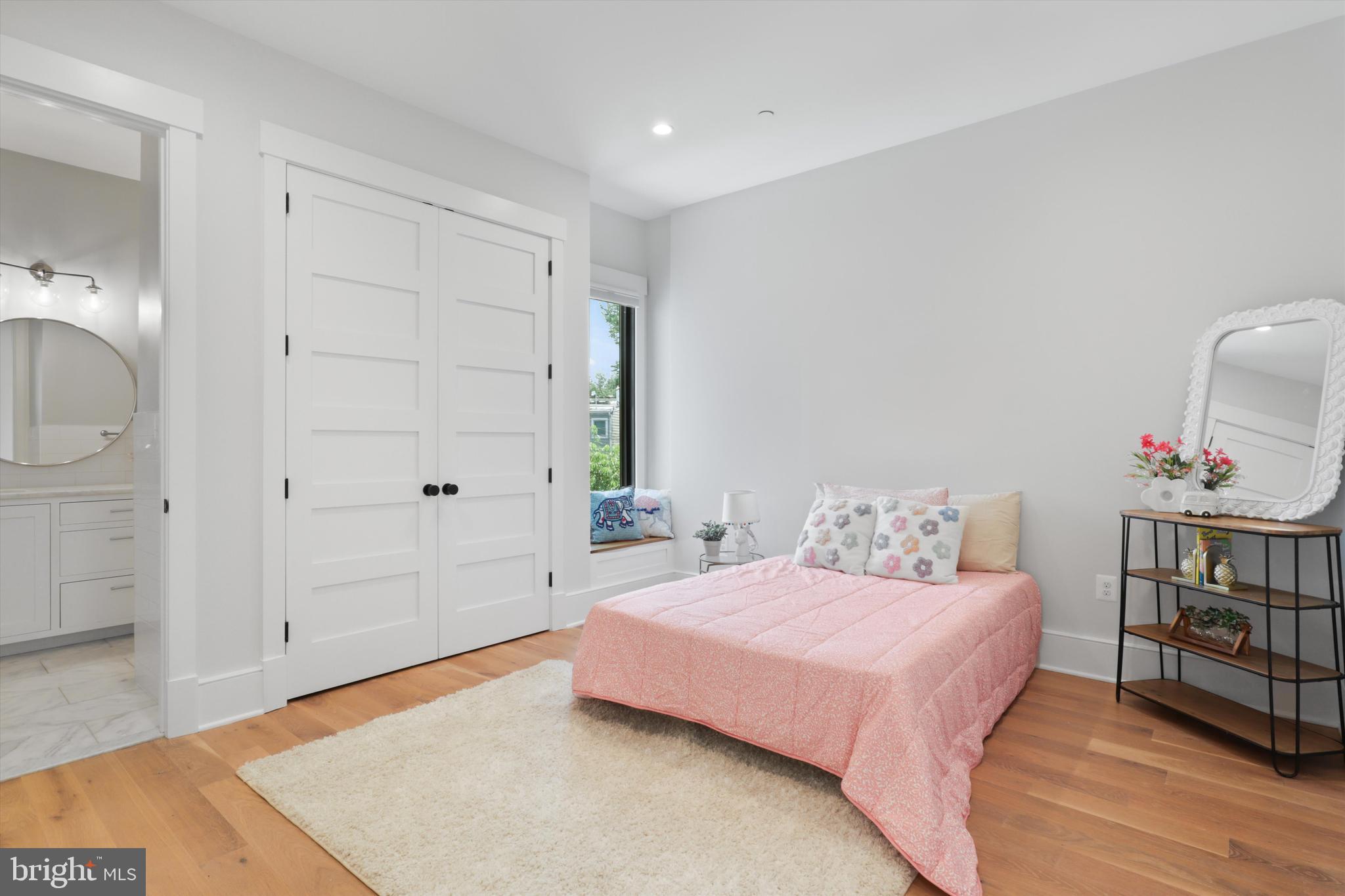 1432 G Street Southeast Washington, DC 20003 - Photo 30 of 56 a bedroom with a bed and a table