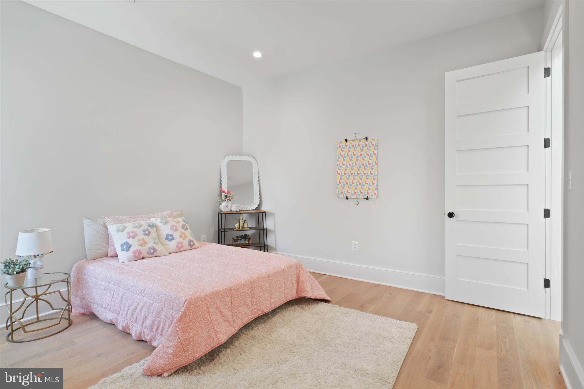 1432 G Street Southeast Washington, DC 20003 - Photo 31 of 56 a bedroom with a bed and wooden floor