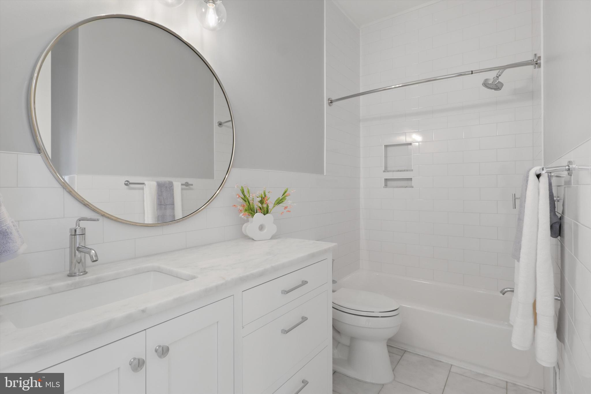 1432 G Street Southeast Washington, DC 20003 - Photo 32 of 56 a bathroom with a sink a toilet and shower
