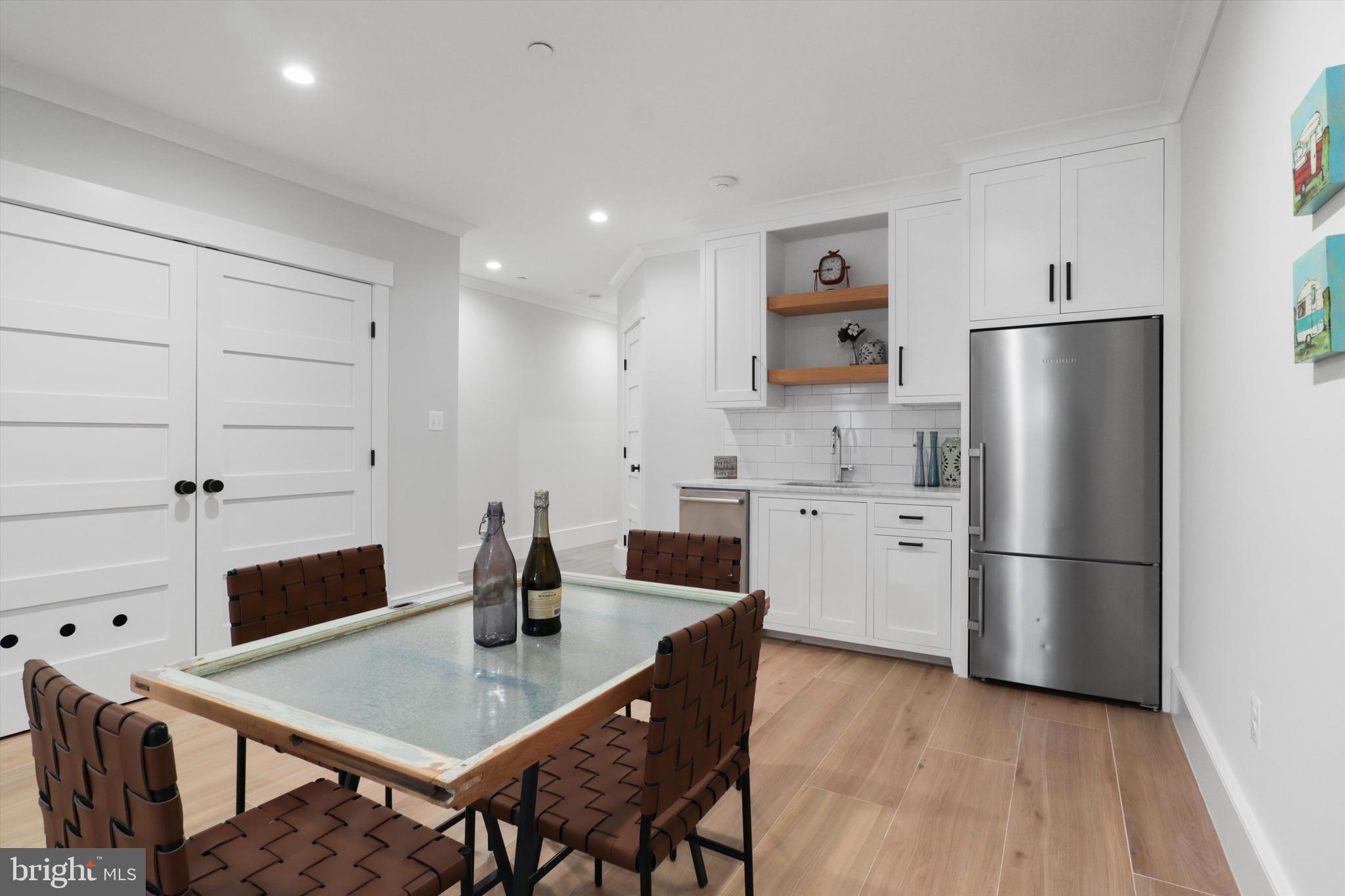 1432 G Street Southeast Washington, DC 20003 - Photo 39 of 56 a kitchen with stainless steel appliances a refrigerator and a stove top oven