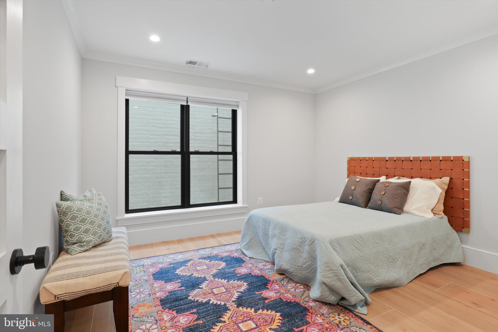 1432 G Street Southeast Washington, DC 20003 - Photo 43 of 56 a bedroom with a bed and a window