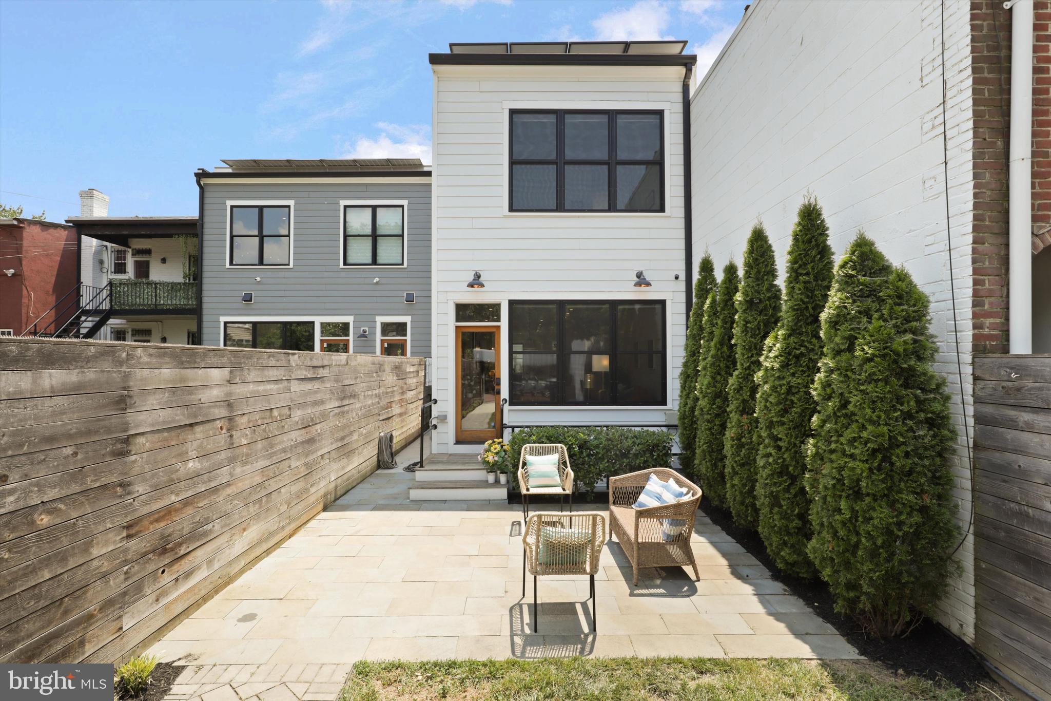 1432 G Street Southeast Washington, DC 20003 - Photo 45 of 56 a front view of a house with a yard