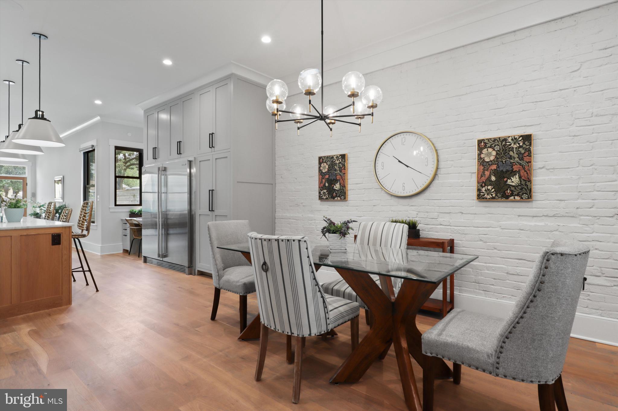 1432 G Street Southeast Washington, DC 20003 - Photo 9 of 56 a view of a dining room with furniture a chandelier and wooden floor