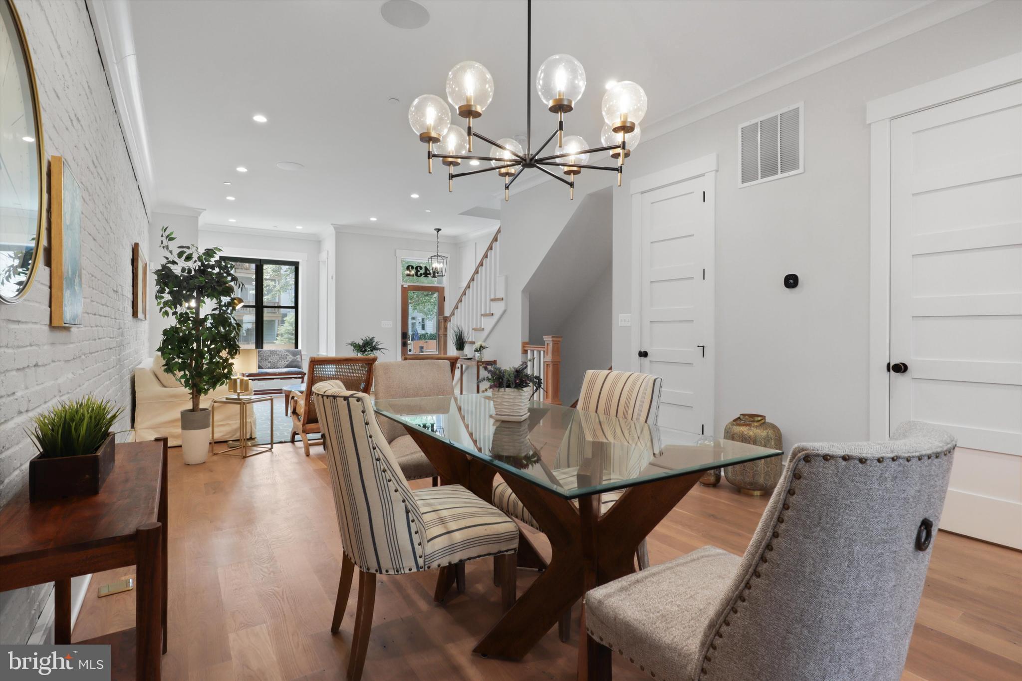 1432 G Street Southeast Washington, DC 20003 - Photo 10 of 56 a view of a dining room with furniture and wooden floor