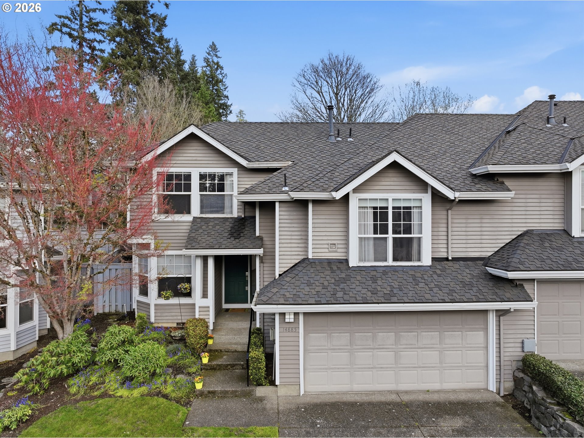 14885 Southwest Osprey Court Beaverton, OR 97007 - Photo 1 of 31 a front view of a house with a garage