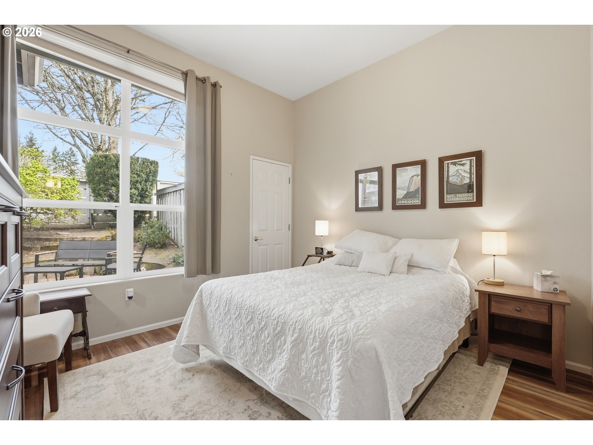 14885 Southwest Osprey Court Beaverton, OR 97007 - Photo 12 of 31 a bedroom with a large bed and a window