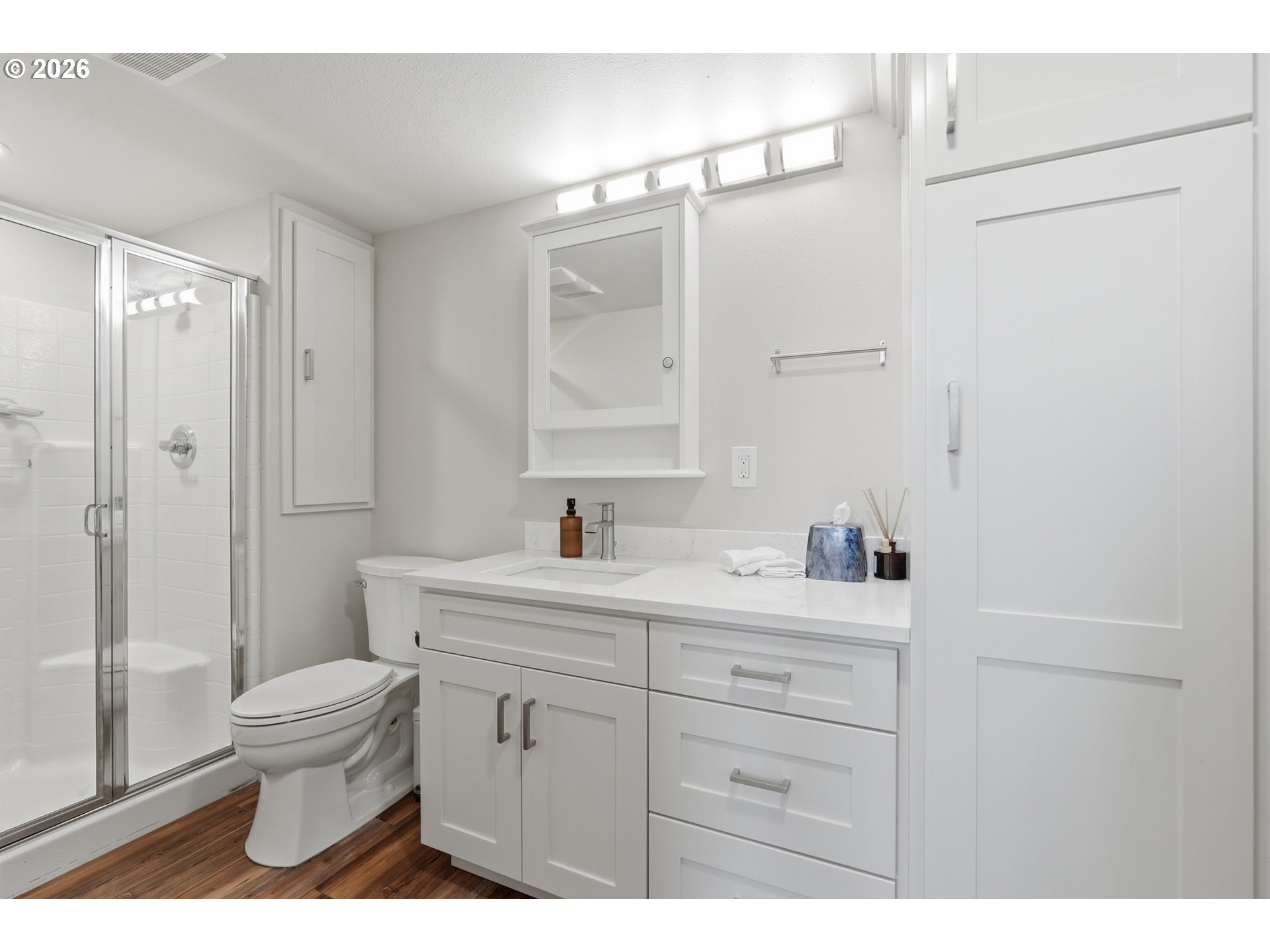 14885 Southwest Osprey Court Beaverton, OR 97007 - Photo 14 of 31 a bathroom with a sink a toilet and a large mirror