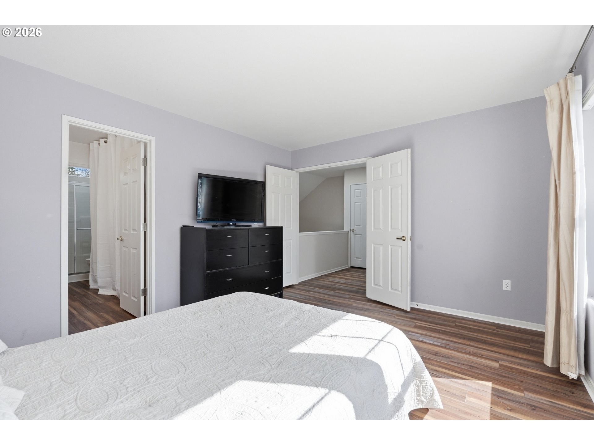 14885 Southwest Osprey Court Beaverton, OR 97007 - Photo 19 of 31 a bedroom with a bed and a flat screen tv