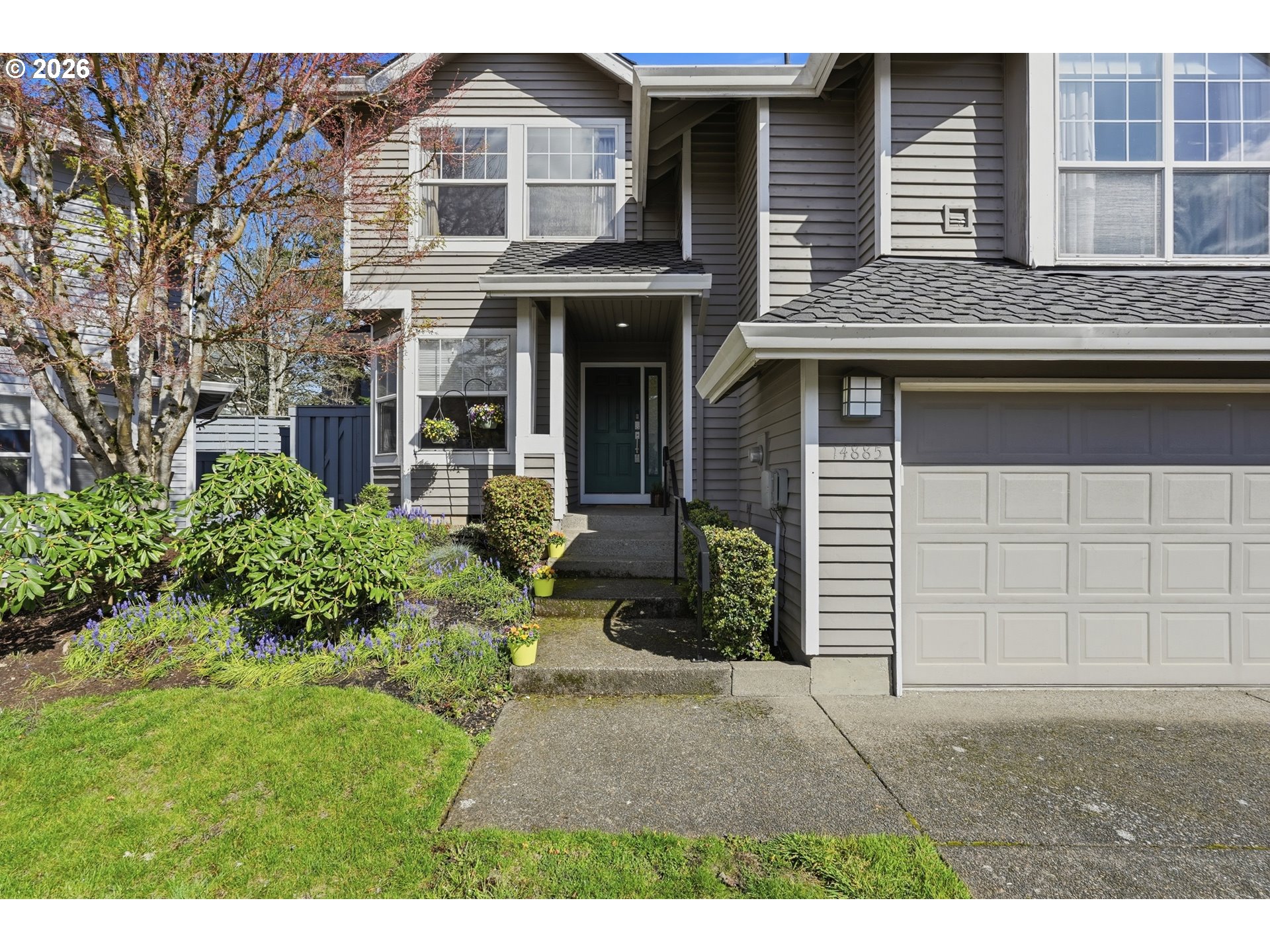 14885 Southwest Osprey Court Beaverton, OR 97007 - Photo 2 of 31 a front view of a house with a garden