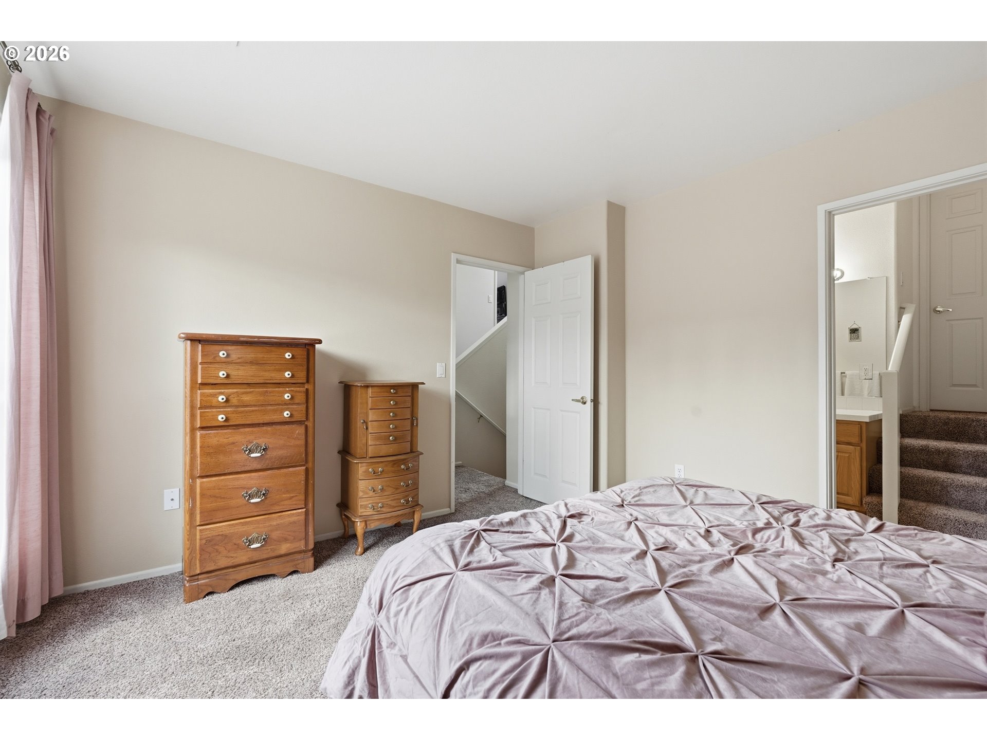 14885 Southwest Osprey Court Beaverton, OR 97007 - Photo 22 of 31 a bedroom with a bed and a dresser