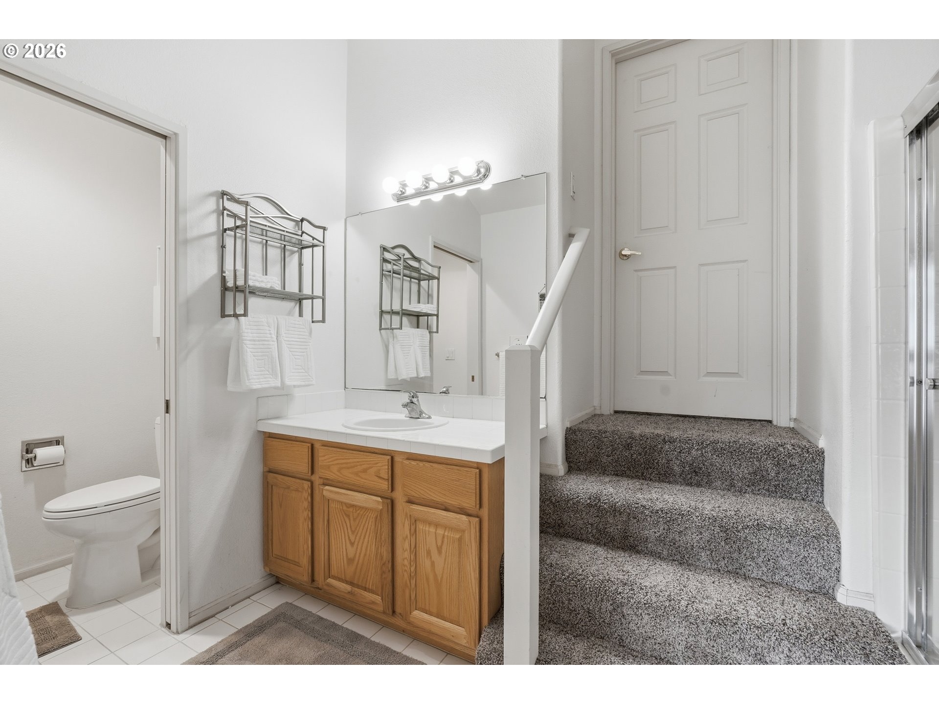 14885 Southwest Osprey Court Beaverton, OR 97007 - Photo 23 of 31 a bathroom with a sink a toilet and shower