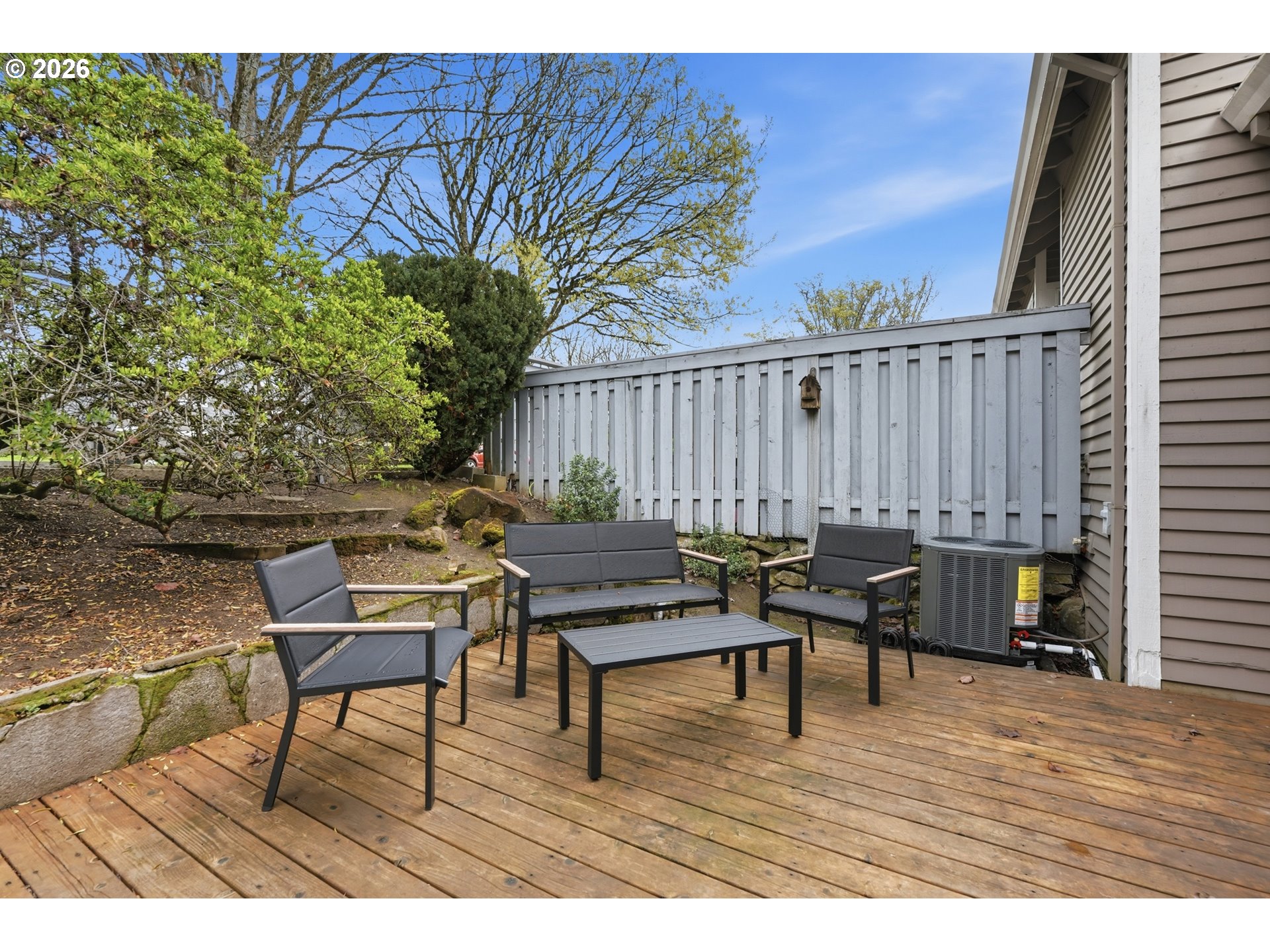 14885 Southwest Osprey Court Beaverton, OR 97007 - Photo 27 of 31 a terrace with wooden floor table and chairs