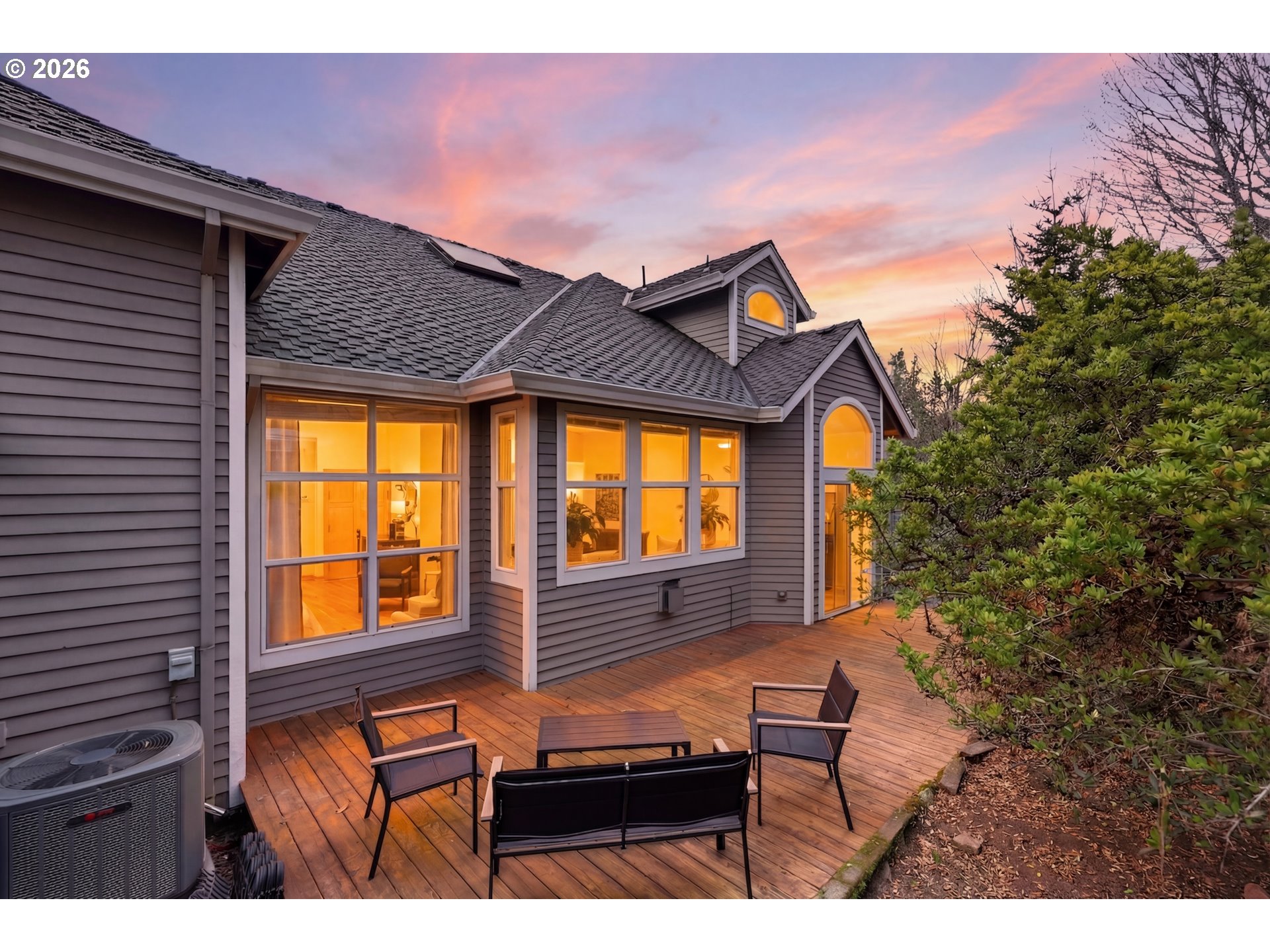 14885 Southwest Osprey Court Beaverton, OR 97007 - Photo 29 of 31 a backyard of a house with wooden fence and large trees