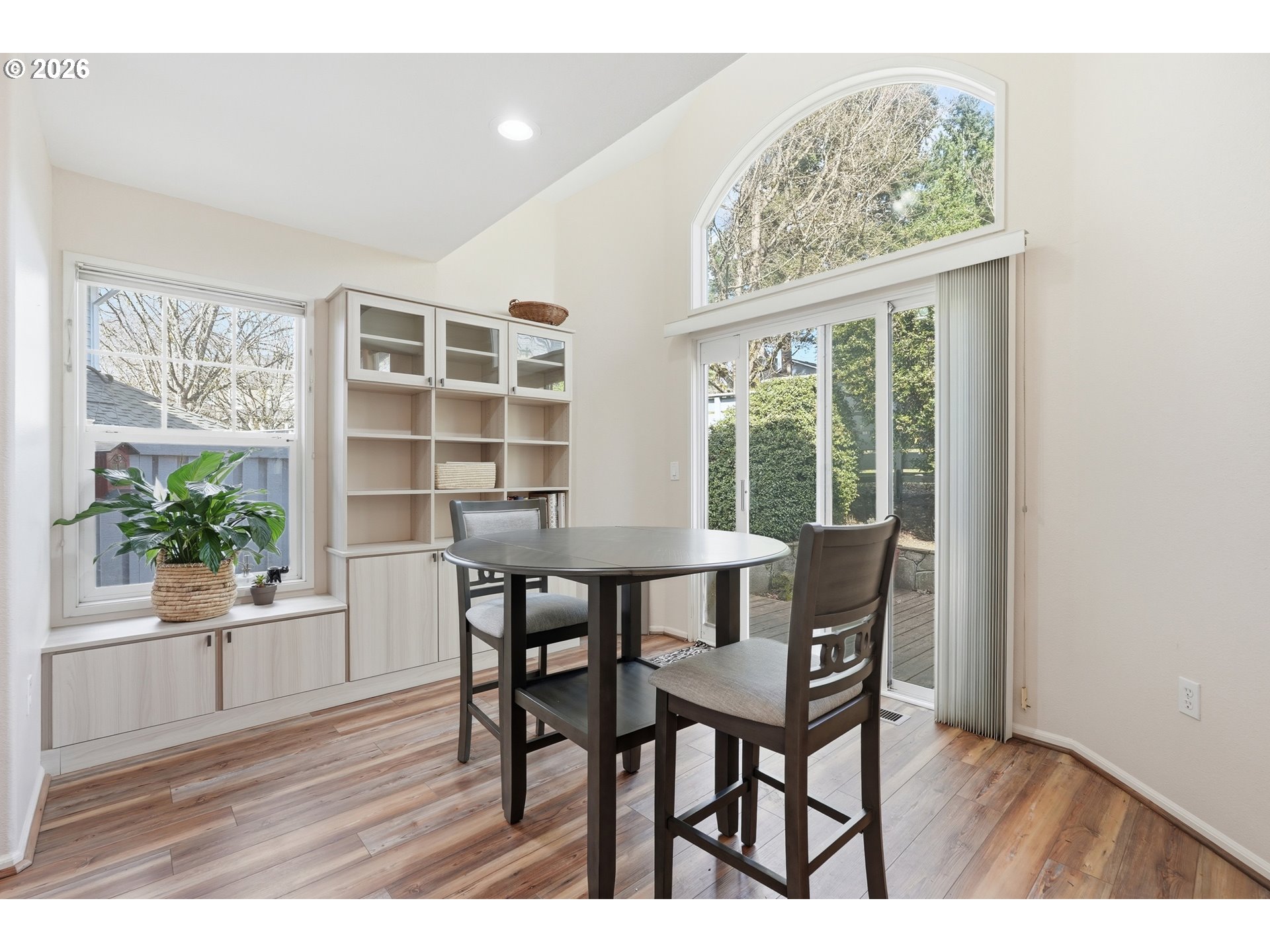14885 Southwest Osprey Court Beaverton, OR 97007 - Photo 9 of 31 a view of a dining room with furniture window and wooden floor