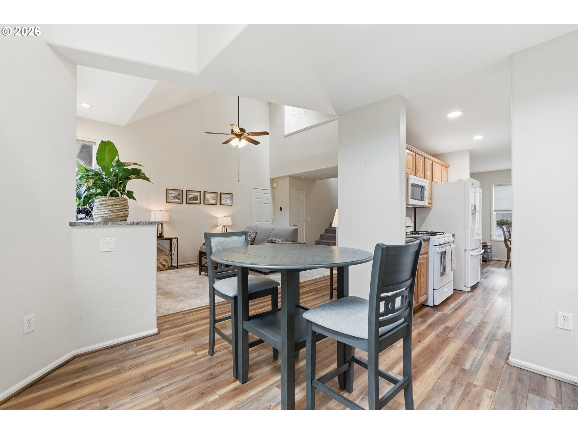 14885 Southwest Osprey Court Beaverton, OR 97007 - Photo 10 of 31 a view of a dining room with furniture and wooden floor