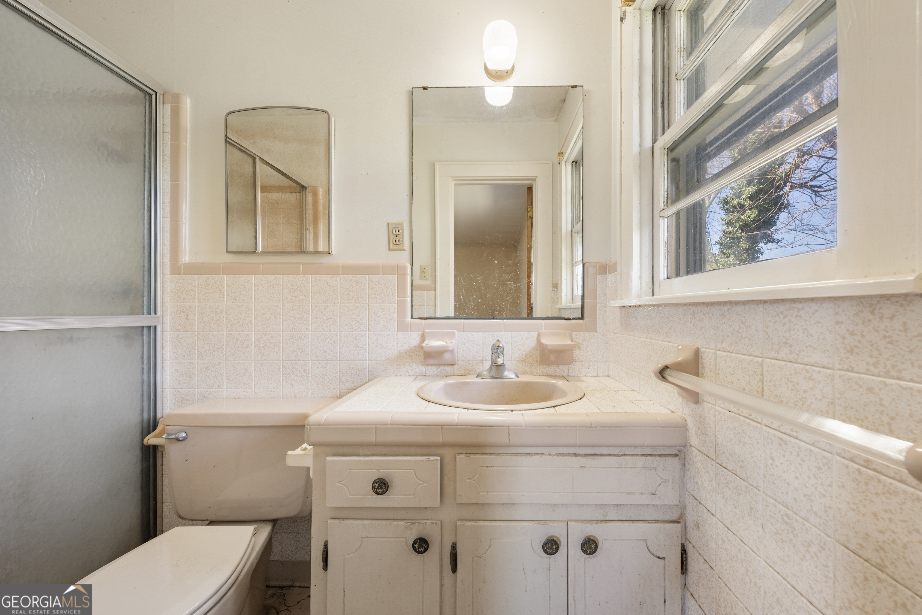 868 Fairview Street Hartwell, GA 30643 - Photo 15 of 42 a bathroom with a toilet sink and mirror