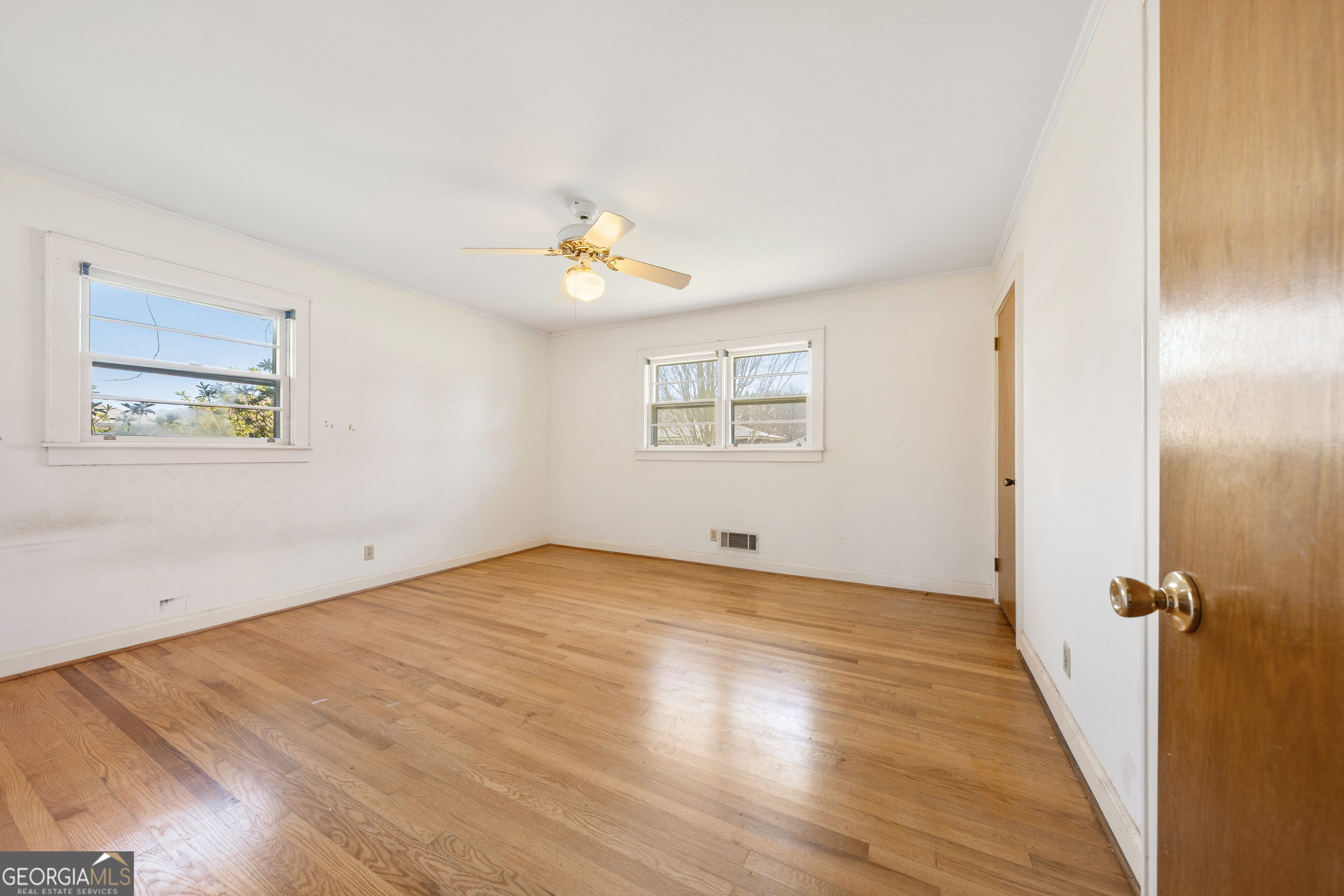868 Fairview Street Hartwell, GA 30643 - Photo 17 of 42 wooden floor in an empty room with a window