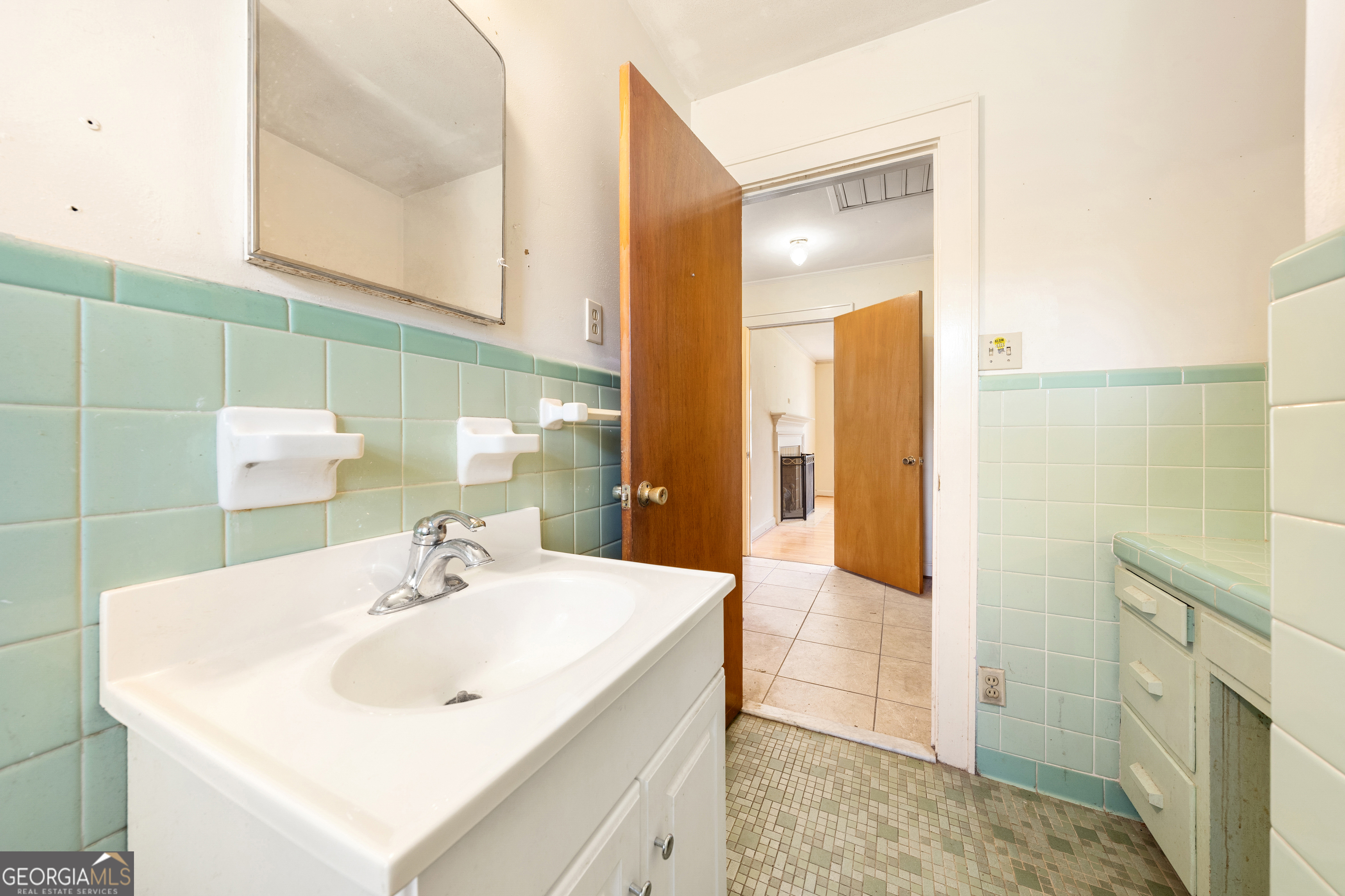 868 Fairview Street Hartwell, GA 30643 - Photo 20 of 42 a bathroom with a sink and a mirror