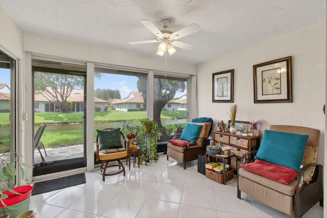 a kitchen with white cabinets sink and stainless steel appliances