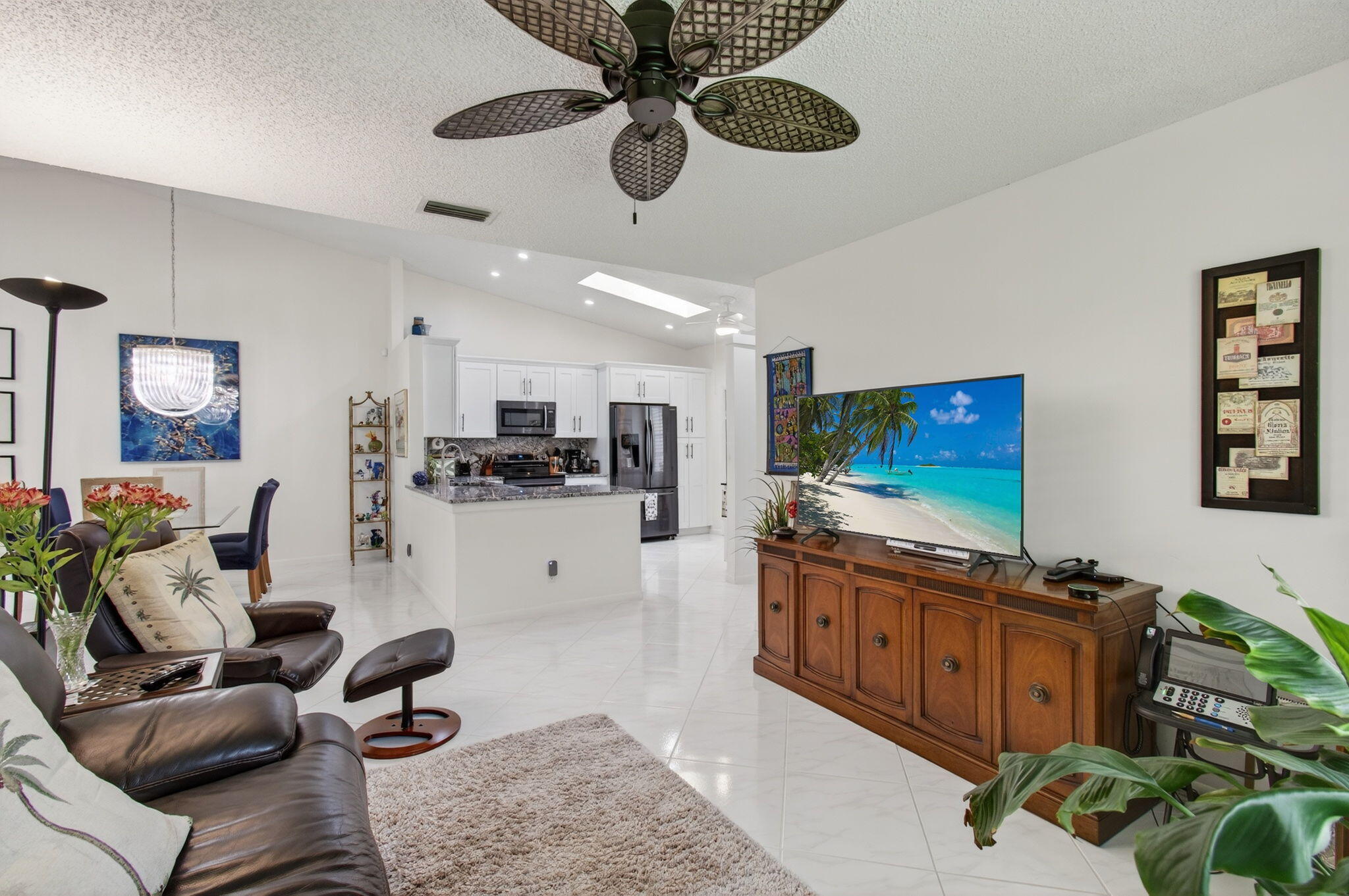 6368 Mill Pointe Circle Delray Beach, FL 33484 - Photo 29 of 132 a living room with furniture and a flat screen tv
