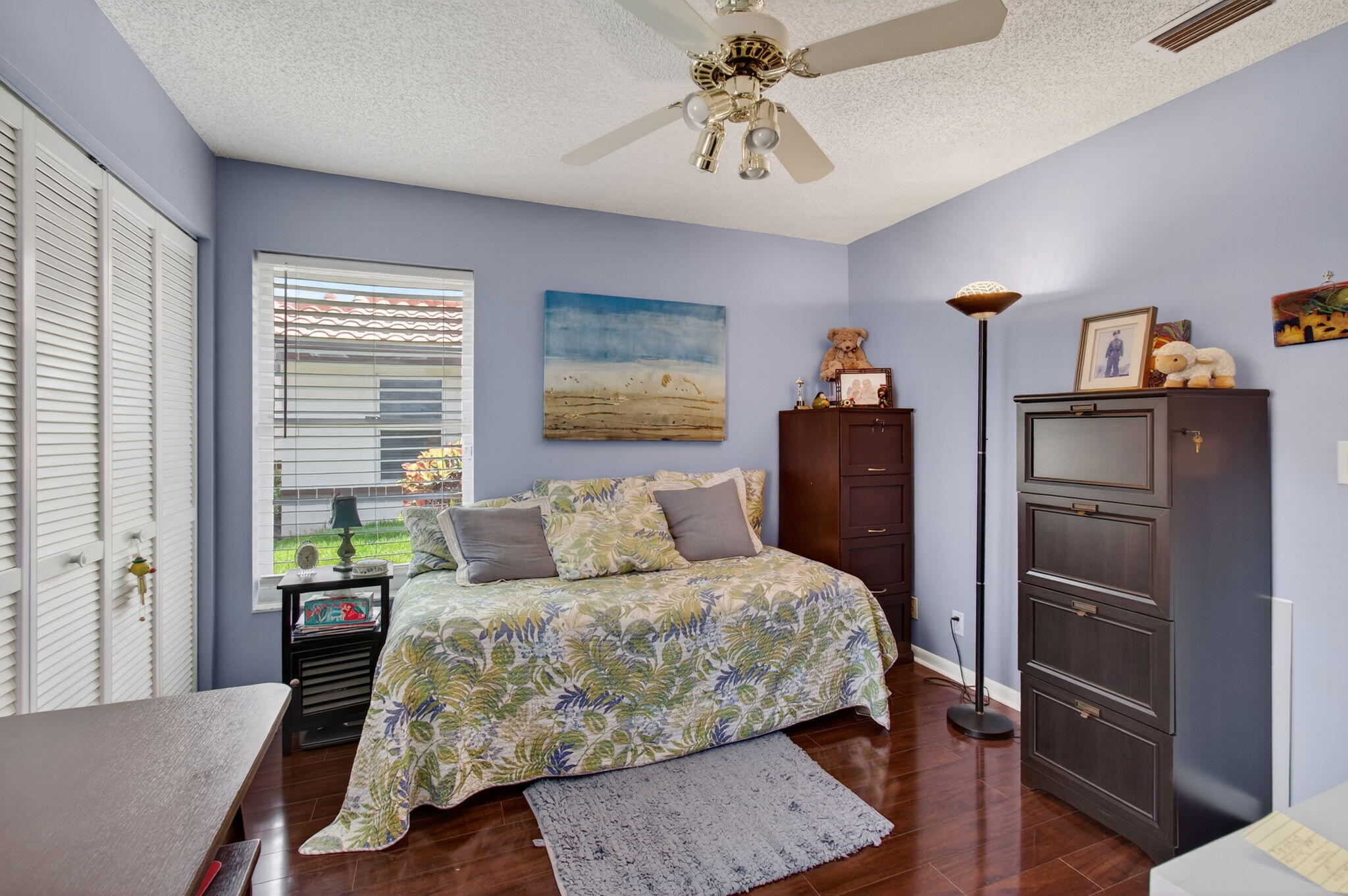 6368 Mill Pointe Circle Delray Beach, FL 33484 - Photo 51 of 132 a bedroom with a bed and wooden floor