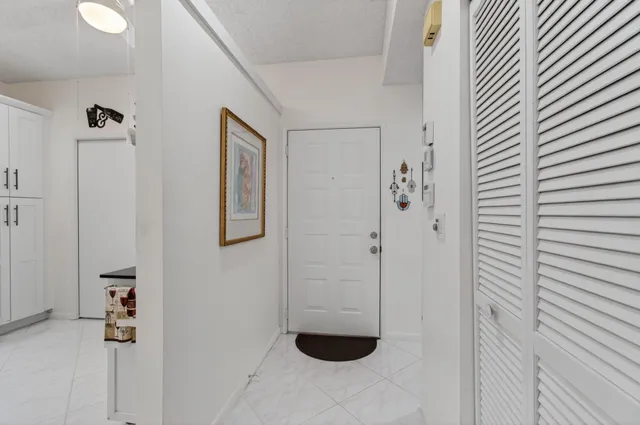 a bedroom with furniture and workout equipment