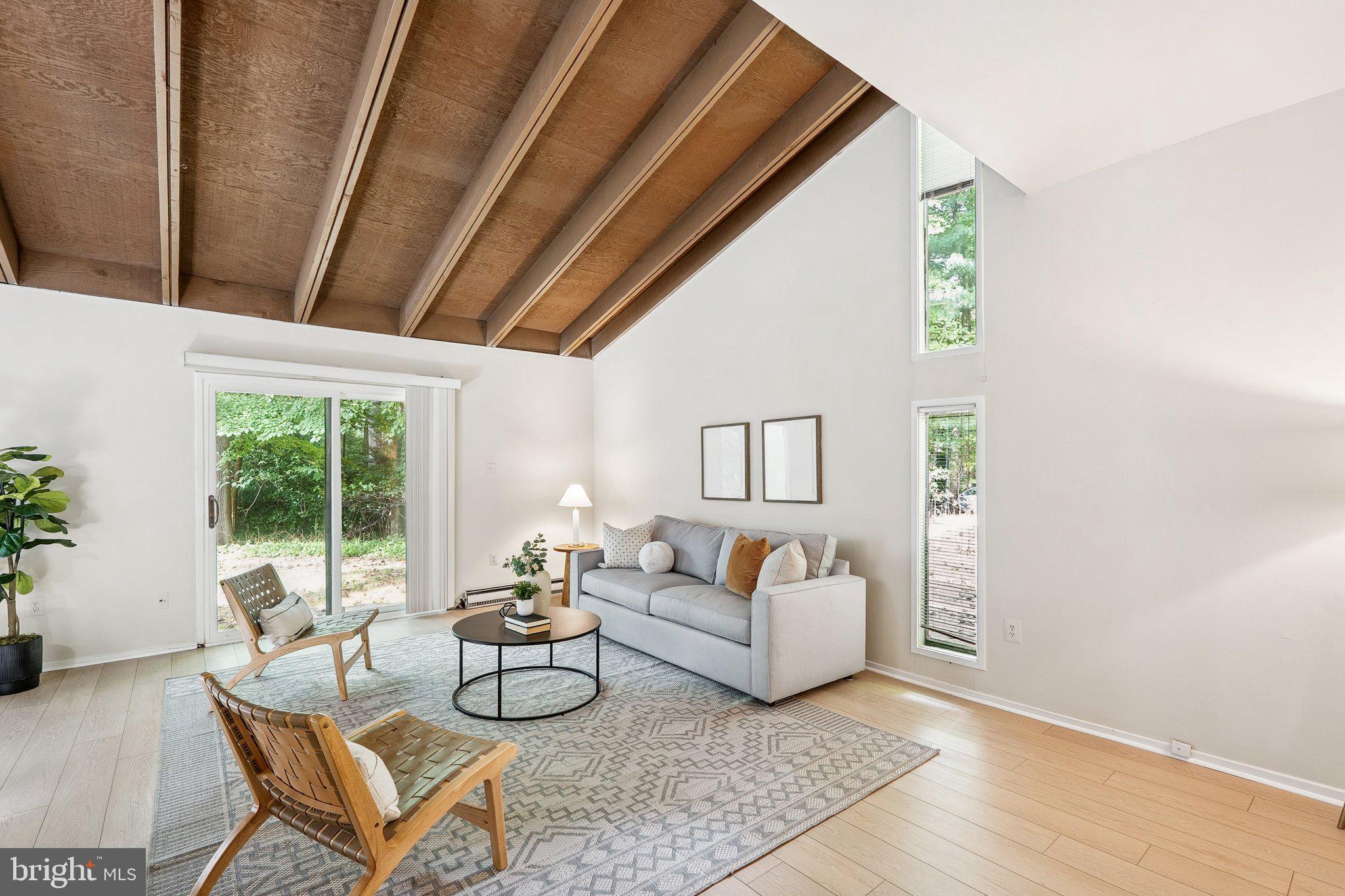 2343 Glade Bank Way Reston, VA 20191 - Photo 1 of 38 a living room with furniture and a large window