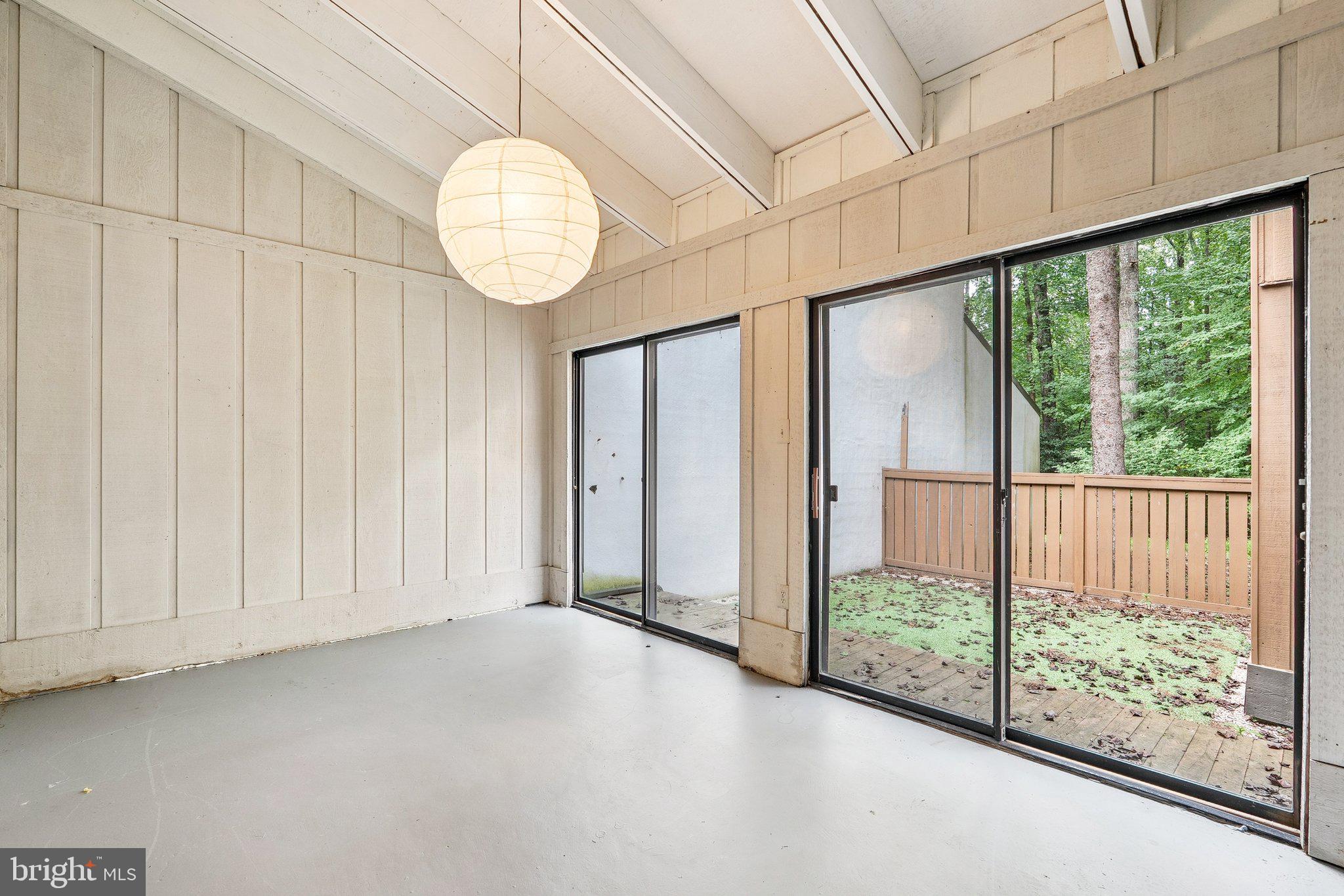 2343 Glade Bank Way Reston, VA 20191 - Photo 17 of 38 an empty room with wooden floor and windows