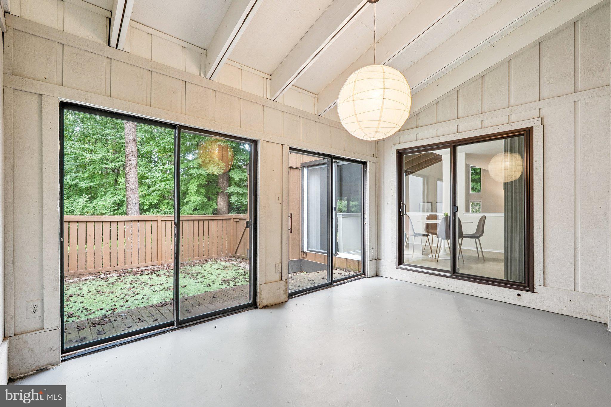 2343 Glade Bank Way Reston, VA 20191 - Photo 18 of 38 a view of an empty room with wooden floor and a window
